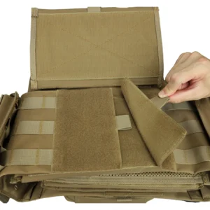 Open front flap on tan plate carrier showing hook-and-loop attachment system