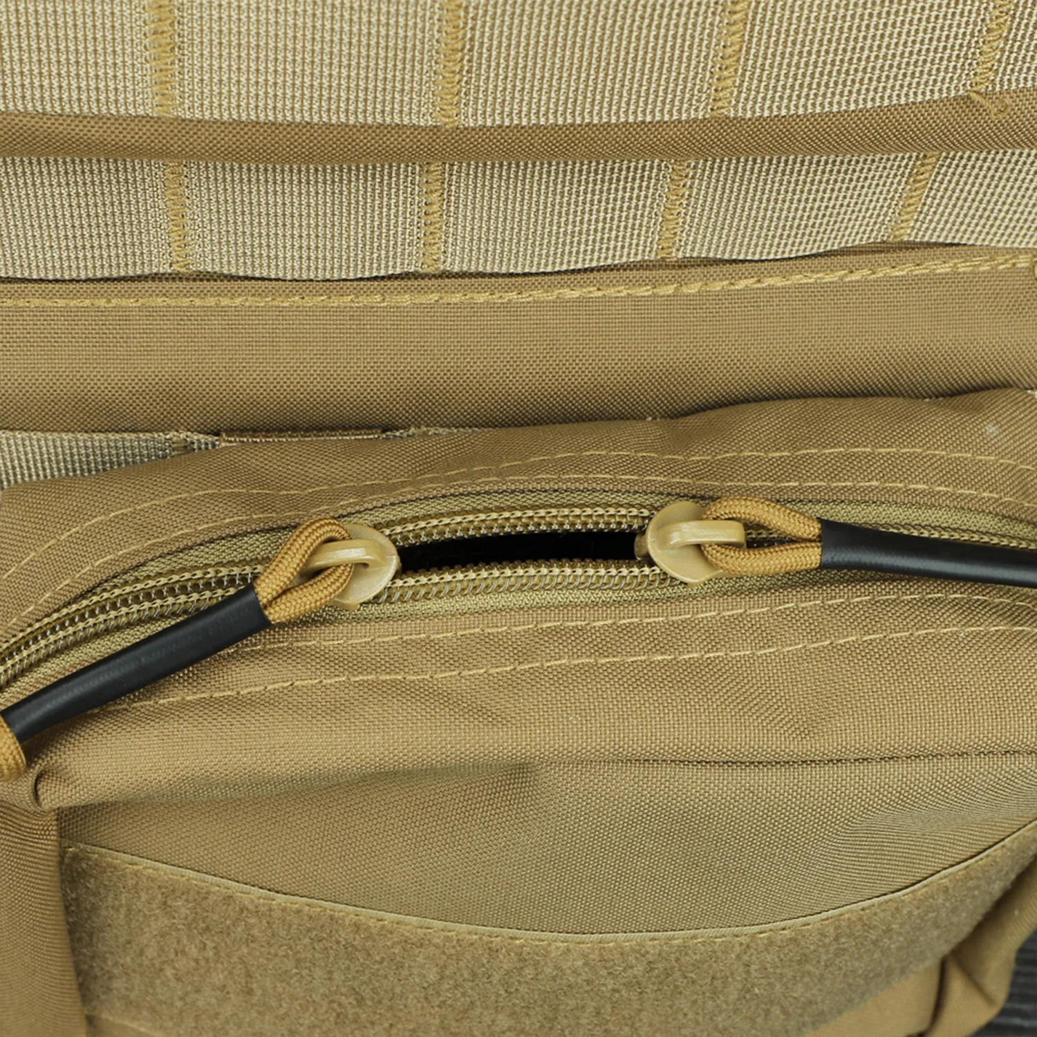 Close-up of tan plate carrier zippered pouch and fabric texture