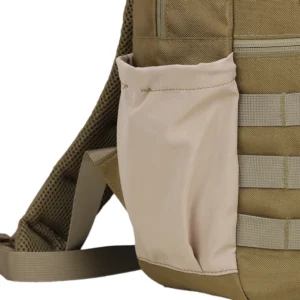 Close-up of side pocket on tan compact tactical backpack for bottle or small gear storage