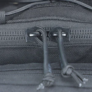 Close-up of zipper pulls on black tactical waist bag