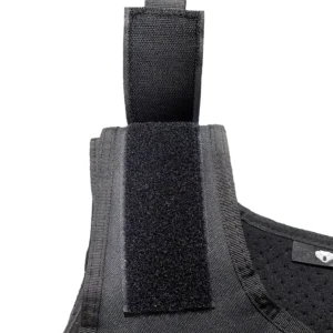 Close-up of shoulder hook-and-loop adjustment on black tactical vest