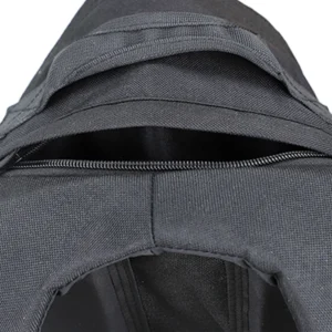 Close-up of black backpack top handle, zipper opening, and reinforced fabric construction