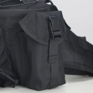 Side pouch detail on black tactical waist bag with flap closure