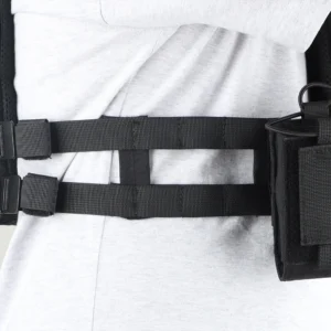 Close-up of side webbing straps on black plate carrier vest