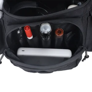 Front compartment of tactical waist bag with organizer pockets and gear