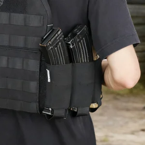 Close-up of black elastic cummerbund side pockets with magazines on tactical vest