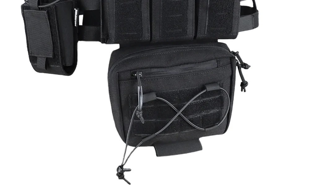 Plate carrier dangler utility pouch detail with zipper pocket, bungee cord retention and hook-and-loop mounting panel.